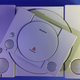 A PlayStation Classic sitting atop an original PlayStation.